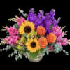 A bold, cheerful arrangement that reads like a painter's palette - the