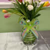 A cheerful cluster of mixed-color tulips creates an immediate springtime lift-perfect as