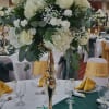 A large, elevated centerpiece designed for weddings and upscale events, this white
