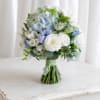 A soft, romantic bridal bouquet in white, pale blue, and touches of