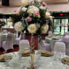 An elevated, formal centerpiece perfect for a wedding or reception, this tall