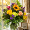 A bold sunflower takes center stage in this Full of sunshine flower