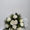 Bouquet of white roses with greenery and white wrap