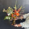 A mix of unique flowers like scabiosa, Queen Anne's Lace and snapdragons.