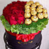 Luxury flower arrangement handcrafted with premium red roses, Ferrero Rocher chocolates, decorative