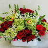 Luxury flower arrangement handcrafted with premium red roses, green orchids, hydrangeas, snapdragons