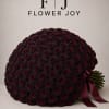 A dramatic arrangement of 101 deep burgundy roses, hand-tied with an elegant