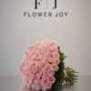 A charming bouquet of 50 soft pink roses, beautifully finished with delicate