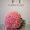 A luxurious arrangement of 75 fresh pink roses, created to express admiration