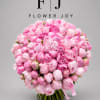 A breathtaking arrangement of lush pink peonies, gathered into a full, rounded