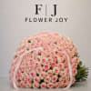 A graceful arrangement of soft blush-pink roses, hand-tied with delicate ribbon details.
