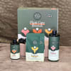 Plant care gift set with three bottles and a pouch in front of a box