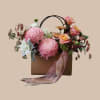 Soft, romantic and effortlessly charming - this flower arrangement in a brown