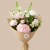 Soft blush pink roses and clustered white hydrangeas make an immediately romantic