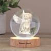 A delicate glass angel glowing from within makes a gentle, lasting sympathy