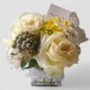 Compact cream and yellow rose arrangement with alstroemeria in a glass cube vase with ribbon, card, and butterfly pick