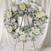 A soft,18-inch  sympathy wreath that speaks of comfort and remembrance -