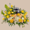 Golden yellow tulips and ruffled ranunculus pair with soft peach roses and
