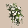 A cascading sweep of white roses, garden roses, lisianthus and daisy-like blooms