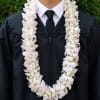 A double-layered white orchid lei 