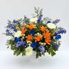 This flower arrangement features lilies, roses, chrysanthemums and airy delphinium arranged to