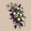 A graceful standing spray that reads like a soft musical phrase, this
