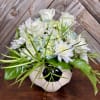 Elegant white roses, soft blue hydrangeas, white chrysanthemums &amp; lush greenery in