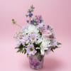 Pink and white mixed bouquet in a floral-patterned vase