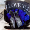 Bouquet of blue roses wrapped in black paper with a ribbon