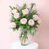 
A classic Valentine&rsquo;s Day arrangement featuring two dozen premium roses paired with
