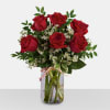 Bouquet of red roses in a clear glass vase