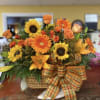 Sunflowers take center stage in this Sunflower Delight Basket, a cheerful flower