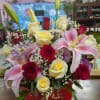 A mix of red and white roses with stargazer lilies.