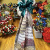 A tall, formal sympathy floral tribute crafted to honor a loved one