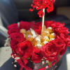 red roses,chocolates, and ballon.
heart loved. 
