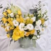This sophisticated floral arrangement is beautifully designed in an elegant ceramic vase