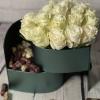 Cream rose bouquet in a dark green box with chocolates
