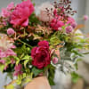A gorgeous hand tie that is bright and beautiful with peonies and