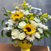 Cheerful bouquet of sunflowers, white roses, and daisies in a yellow smiley mug with a thank you pick.
