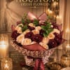 A lavish couture bouquet where deep velvet crimson roses entwine with soft