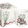 White candle in a frosted glass jar with floral print and matching box