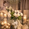 A luminous couture-style arrangement where ivory roses bloom like porcelain silk against
