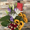 Tall mixed bouquet with red roses, white lilies, sunflowers, and purple flowers