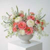 A lush, garden-inspired arrangement designed with an abundant mix of premium blush