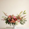 A refined, garden-style arrangement designed with softness and movement in mind. Romantic