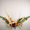 The palette is soft yet vibrant, blending sun-washed peach, blush, and coral