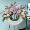White, pink and lavender roses, hydrangeas, lilies and snapdragons form a soft