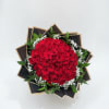 A dense, rounded cluster of deep red roses creates an immediate statement-perfect
