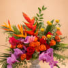 Flowers: orange roses, pink roses, ginger, billy balls, heliconia, italian ruscus, phaelonopsis