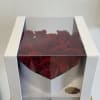 Boxed arrangement of red roses in a white gift box
